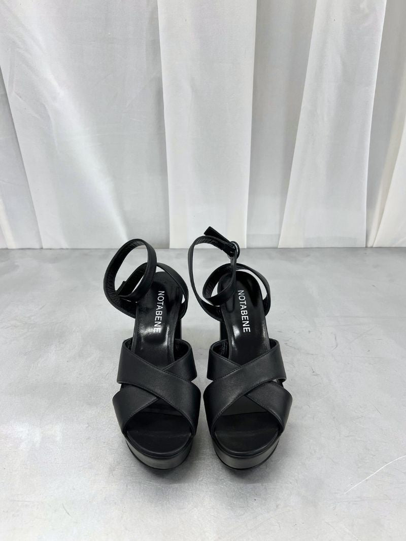 Black platform sandals with ankle strap and crossed straps, size 39